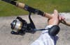 Close-up of angler holding Shimano Spheros spinning combo