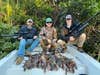 Airgun hunters with iguanas after a successful hunt
