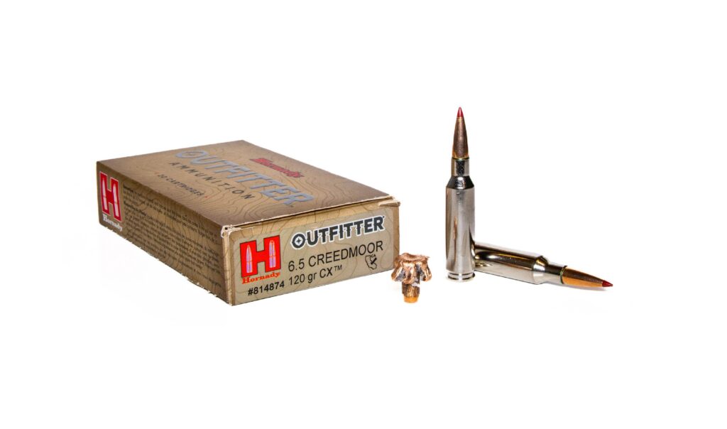 Hornady Outfitter 120-grain CX ammo on. a white background.