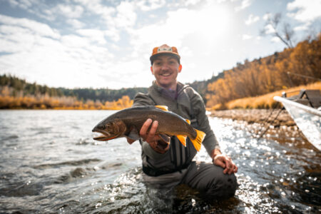 Ryan Chelius holds up trout