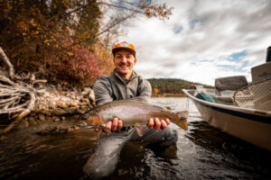 Angler holds up rainbow trout