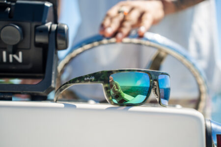 Pair of sunglasses on boat deck