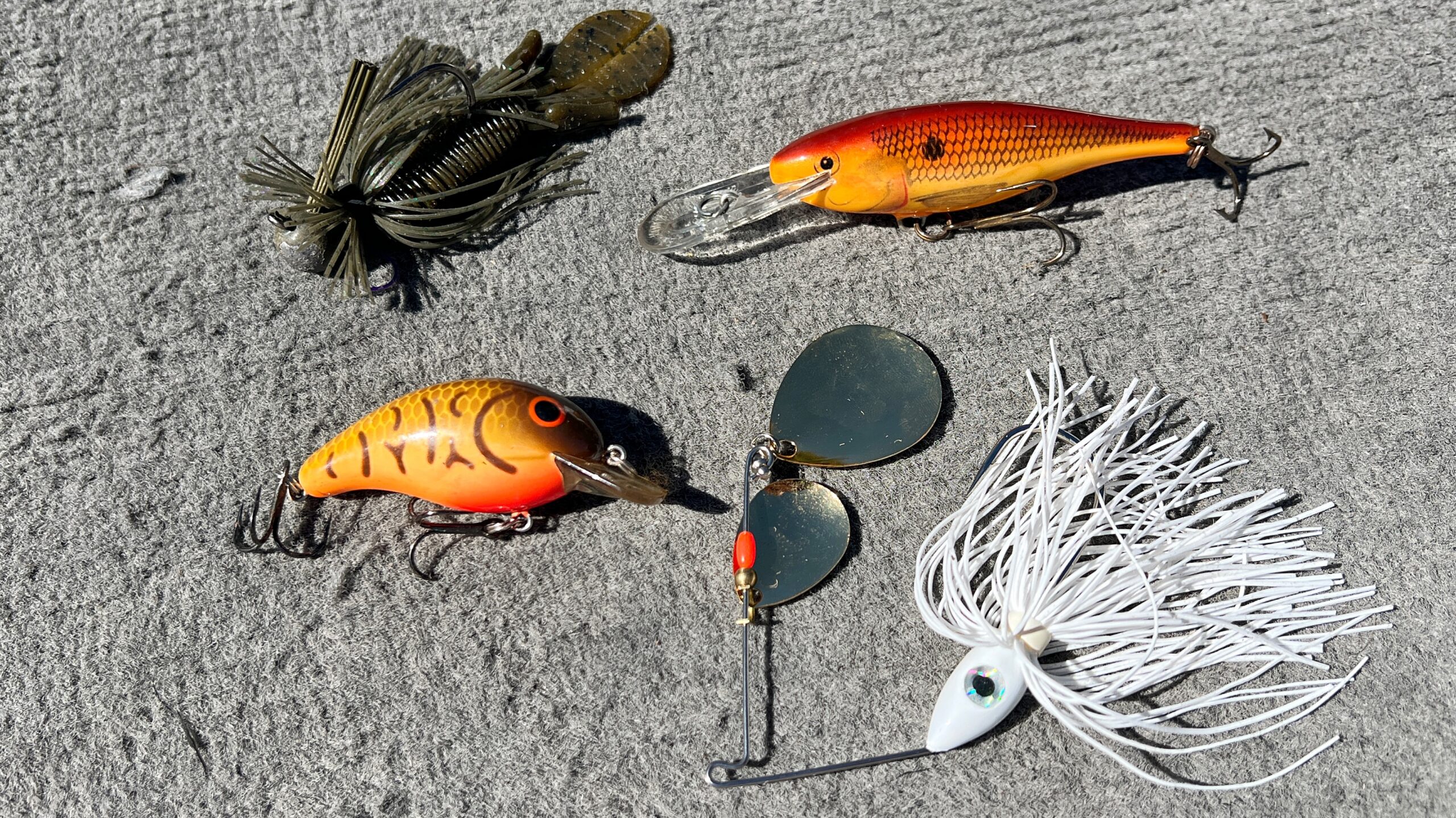 Bass baits on deck of boat