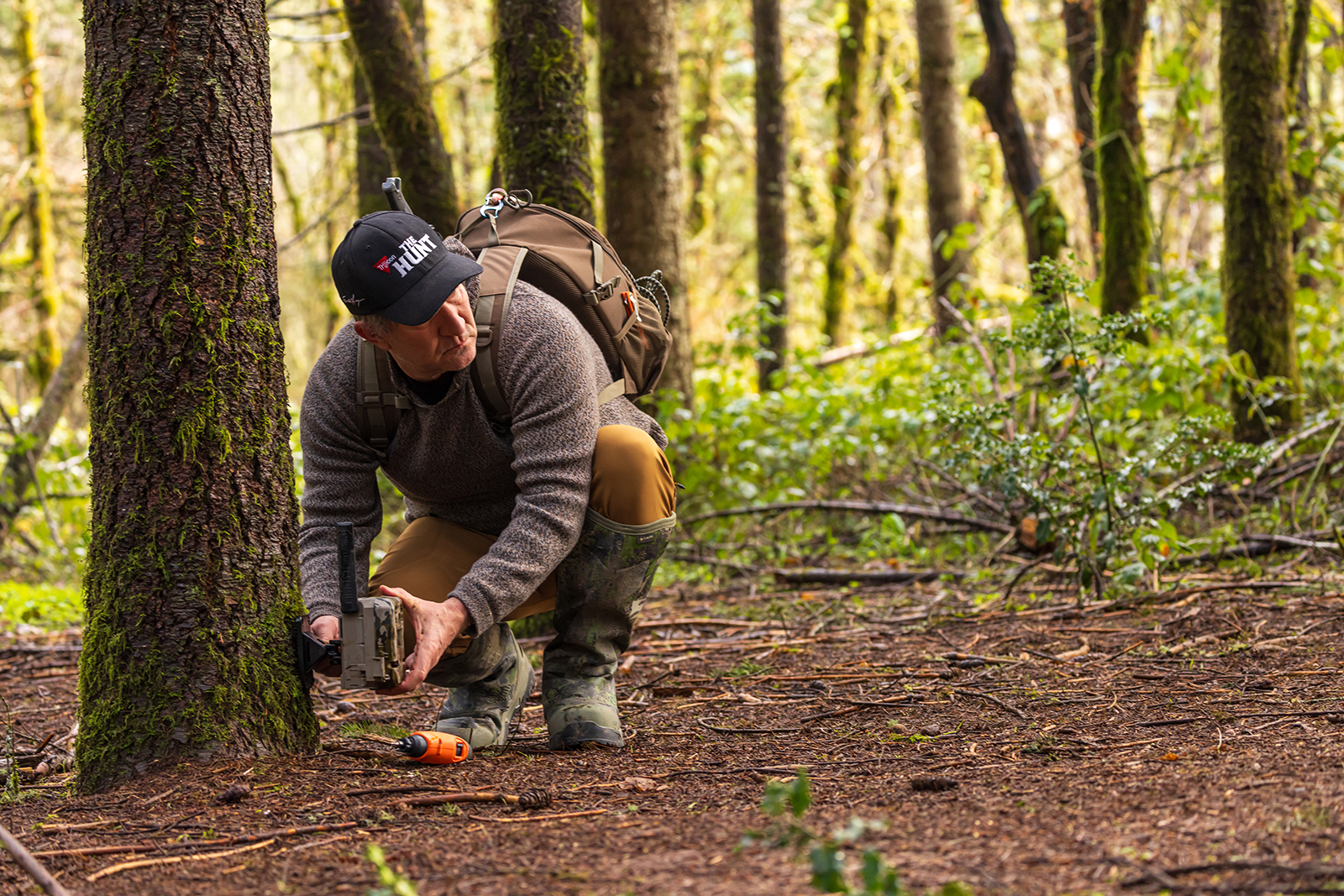 Hunter setting trail camera