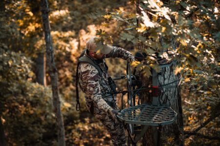 10 Things You Need to Do Before the Archery Deer Opener A bow hunter checks a tree stand high in a tree