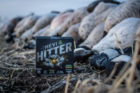 HeviShot HeviHitter Waterfowl Load, Expert Tested HeviShot HeviHitter box of ammo next to pile of geese