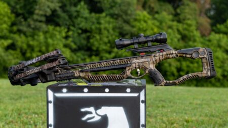 Hunting Crossbow Review: Barnett Whitetail Hunter STR Barnett Whitetail Hunter crossbow with scope displayed on target box outdoors