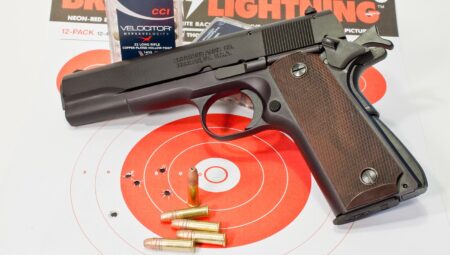 Browning Arms Co. 22 long rifle pistol with ammunition on shooting target