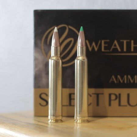 The .300 Weatherby Magnum Is Still the Long Range, Large Game King Two Weatherby Select Plus rifle cartridges displayed in front of ammunition box.