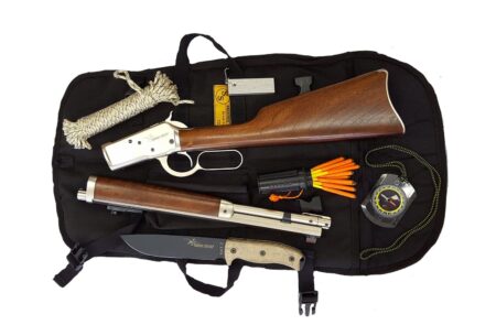Survival kit with lever-action rifle, knife, compass, rope, and matches in black bag