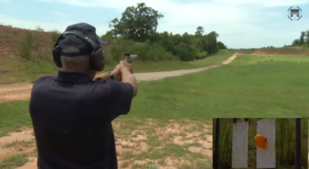 Video: A 1,000-Yard Pistol Shot? Person shooting pistol at orange balloon target on outdoor firing range