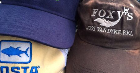 What Makes a Great Flyfishing Hat? Three stacked hats including Foxy's Jost Van Dyke BVI and Costa branded caps