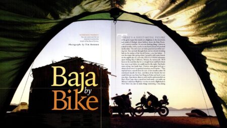 Magazine spread titled Baja by Bike featuring motorcycles parked on a Mexico beach at sunset
