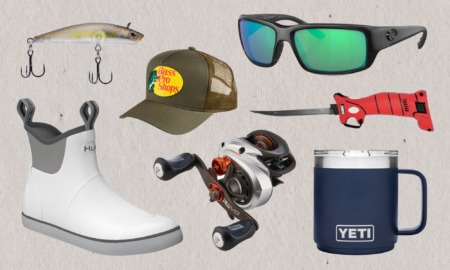 Fishing gear collection including lure, Bass Pro hat, sunglasses, boots, reel, and Yeti mug.