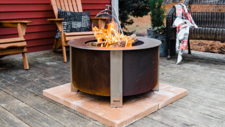 The Best Smokeless Fire Pits, Tested and Reviewed Breeo smokeless wood-burning fire pit blazing on outdoor wooden deck patio
