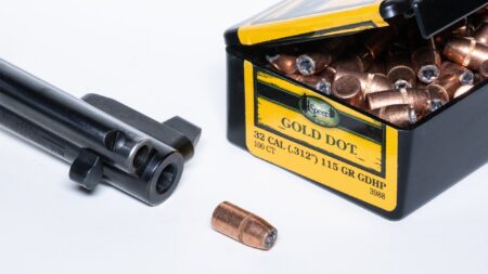 Caliber Definition: It’s Not as Simple As You Think Speer Gold Dot 32 caliber 115 grain hollow point bullets box with firearm barrel