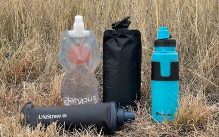 The 5 Best Collapsible Water Bottles (2024 Review) Platypus collapsible water bottle, LifeStraw filter, and Nomader water bottle for outdoor hiking gear.