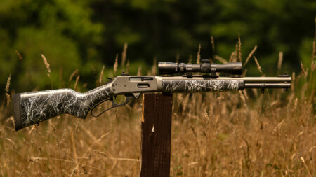 Dove Custom Appalachian Scout Rifle Review—Expert Tested Marlin lever-action rifle with scope and camo finish displayed outdoors on wooden post