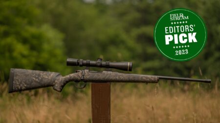 Field & Stream 2023 Editors' Pick bolt-action rifle with scope on wooden post outdoors