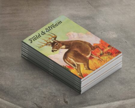Stack of Field & Stream magazines featuring vintage illustrated buck deer cover art.