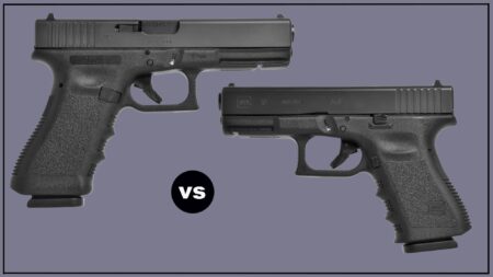 Two black Glock pistols compared side by side on gray background