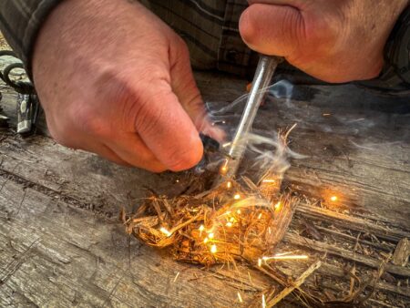 How to Start a Fire Without a Lighter Hands using a ferro rod striker to ignite dry tinder and start a fire