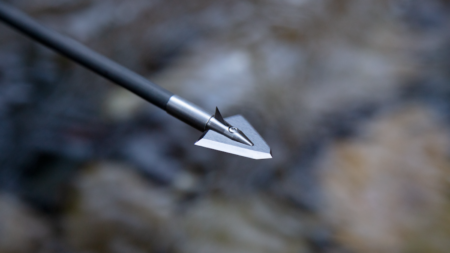The Best Broadheads for Deer of 2024 Close-up of a broadhead arrowhead tip attached to a black carbon arrow shaft