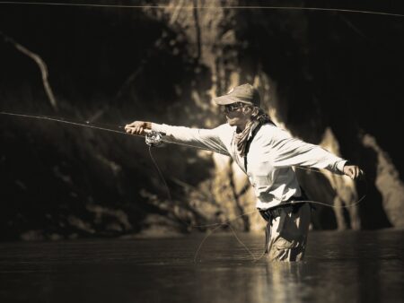 An angler casting a fly rod.