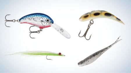 The Best Lures for Lake Trout of 2024 Four fishing lures including crankbaits, streamer fly, and soft plastic swimbait on white background