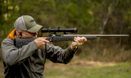 A shooter firing the Nosler Model 21 rifle.