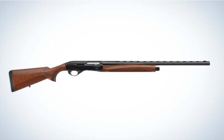 Beretta semi-automatic shotgun with walnut wood stock and black metal barrel