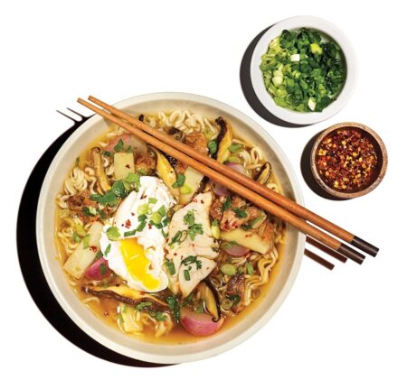 Recipe: How to Make “Alabama Ramen” Bowl of ramen noodle soup with poached egg, mushrooms, chopsticks, and condiments.