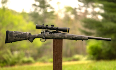 Proof Glacier Ti rifle balanced on a post