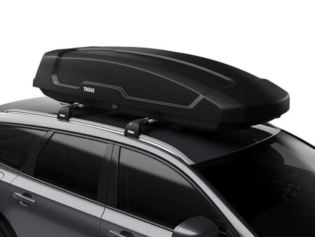 Best Cargo Carriers for Your Vehicle’s Roof Rack Thule black roof cargo box mounted on SUV roof rack crossbars