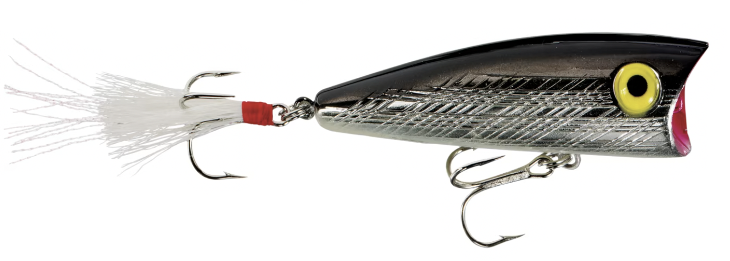 Silver and black topwater popper fishing lure with treble hooks and feather tail