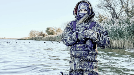 Tidewe Waders Review: Are They Any Good? Person in TideWe camo waders standing in cold water during winter duck hunting.