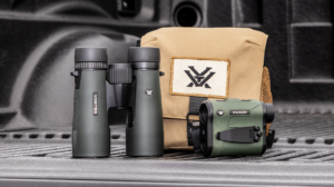Vortex binoculars and Ranger rangefinder with tan carrying case on truck bed