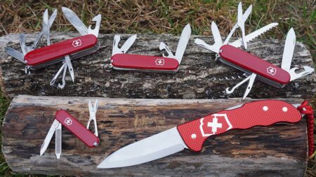 The Best Swiss Army Knives of 2024, Tested and Reviewed Five red Victorinox Swiss Army knives with tools open displayed on wooden log