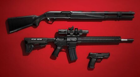 Three black firearms displayed on red background: shotgun, Stag Arms AR-15, and handgun.