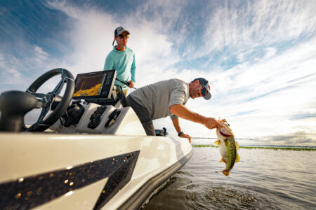 Angler holding largemouth bass