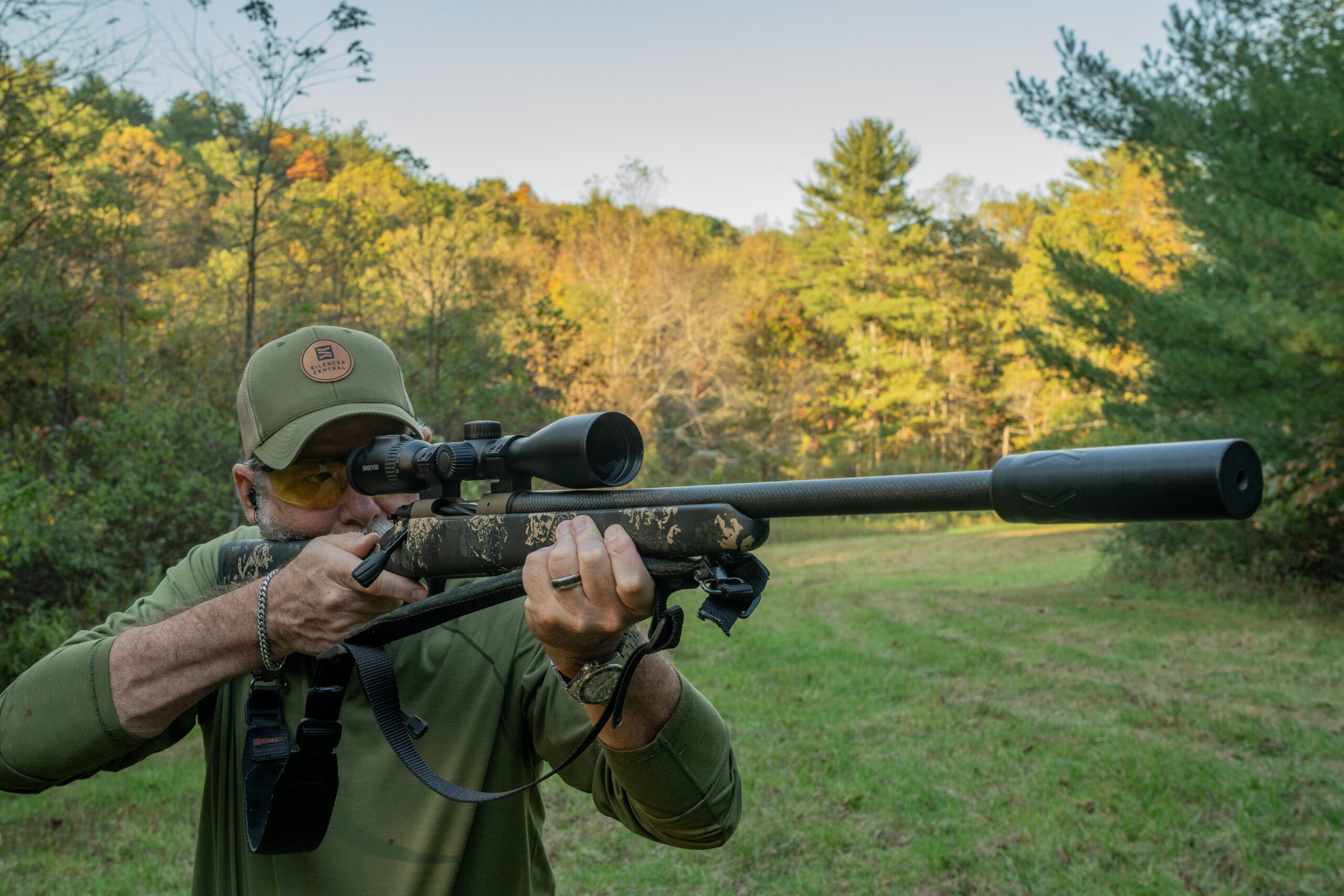 A shooter fires the Christensen Arms Ridgeline FFT in a field. 