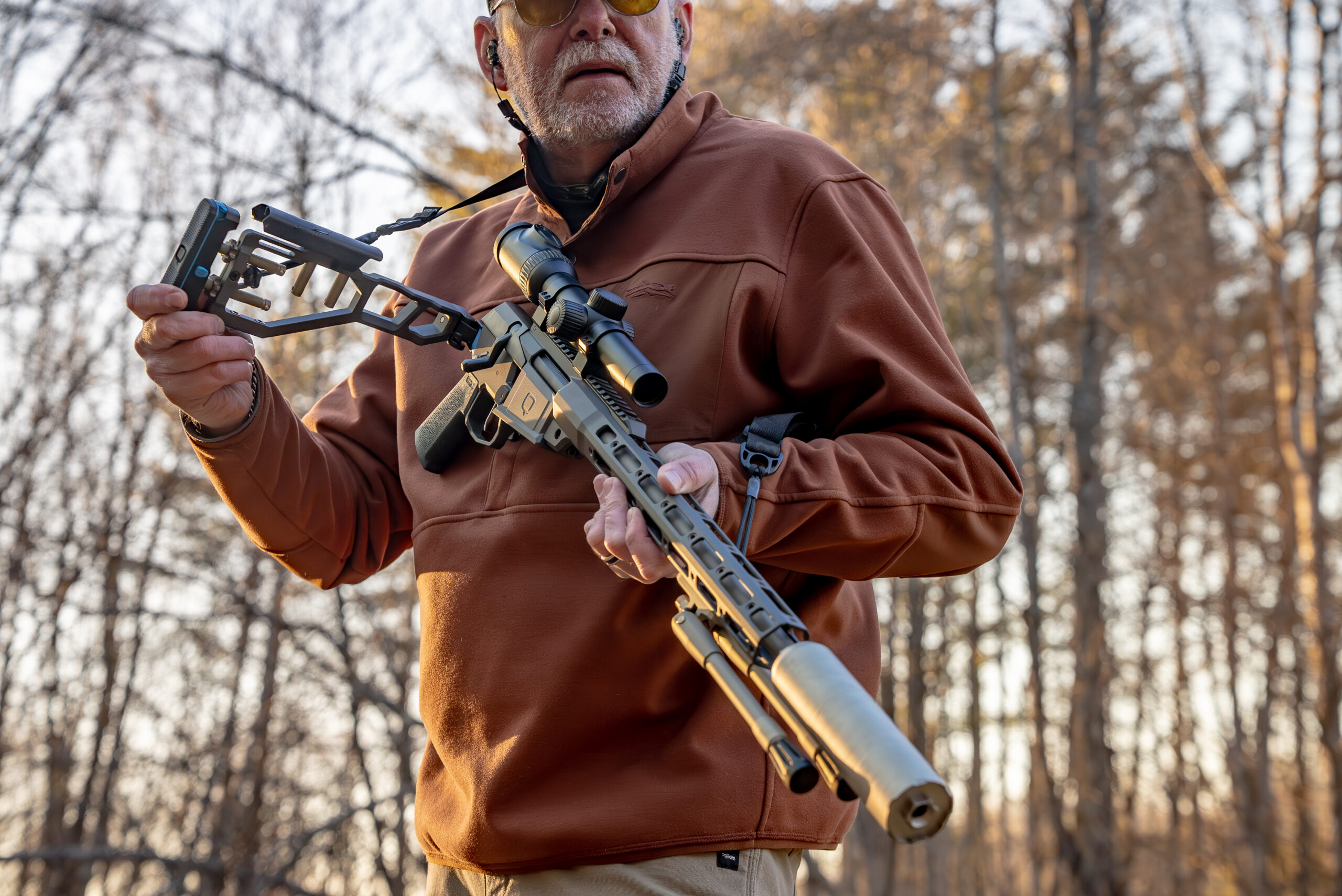 A shooter fold down the buttstock of the Q Fix rifle. 