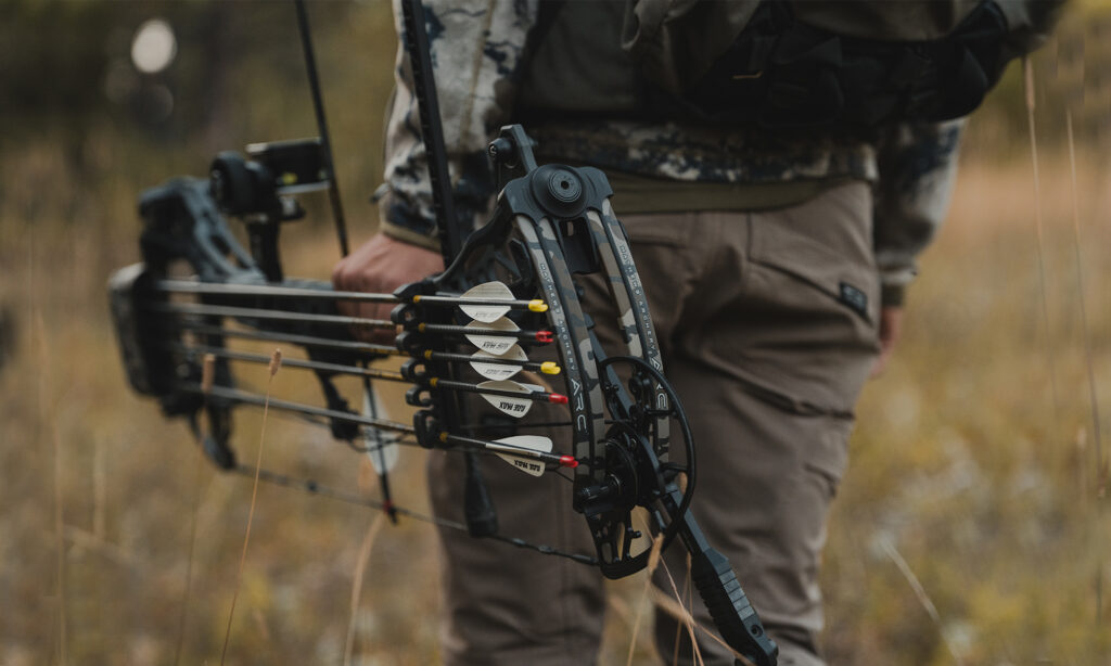 A hunter carries Mathews new ARC 30 compound bow.
