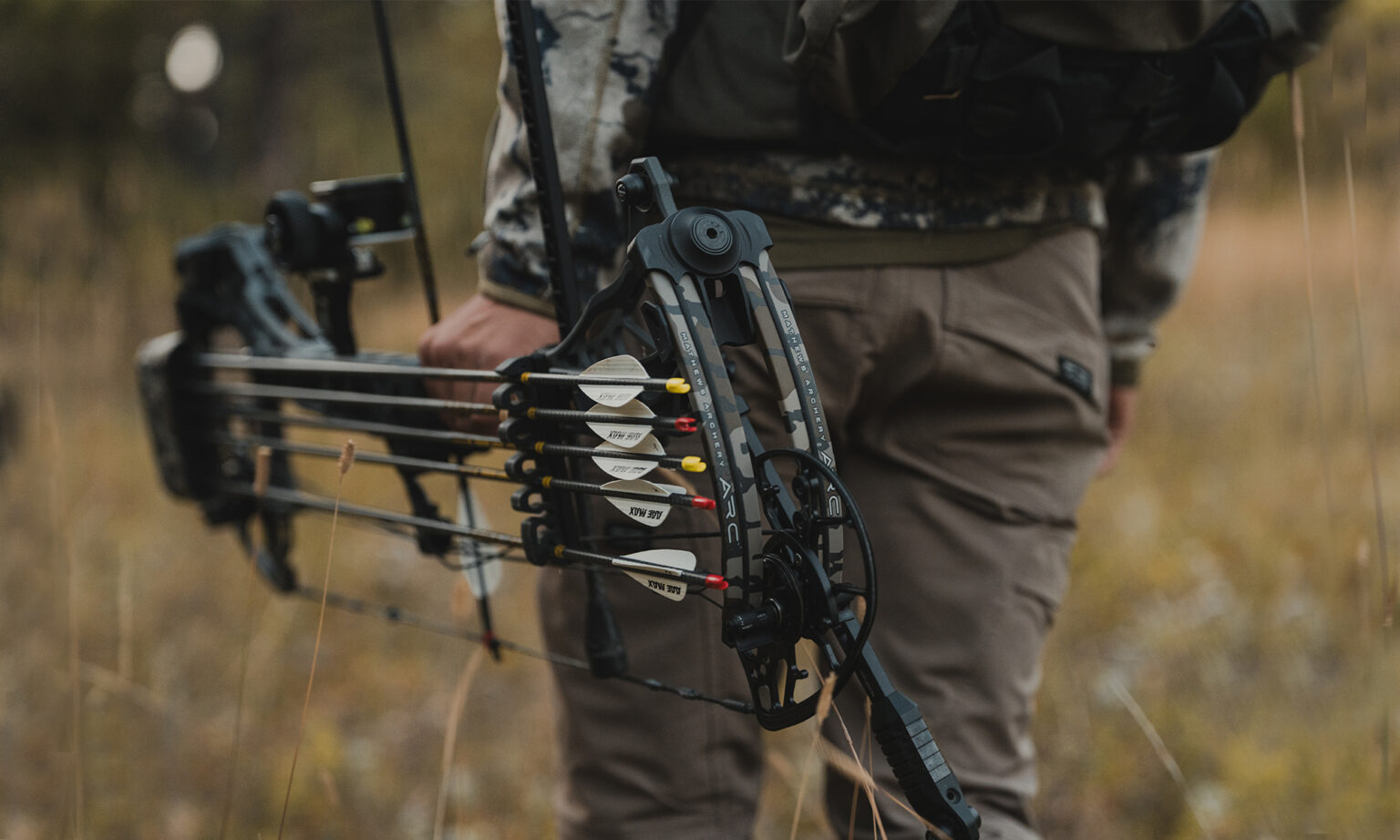 A hunter carries Mathews new ARC 30 compound bow.