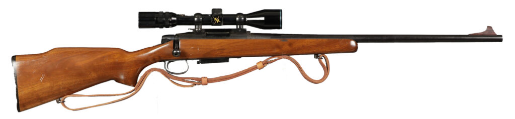 Remington Model 799 bolt-action rifle on white background. 