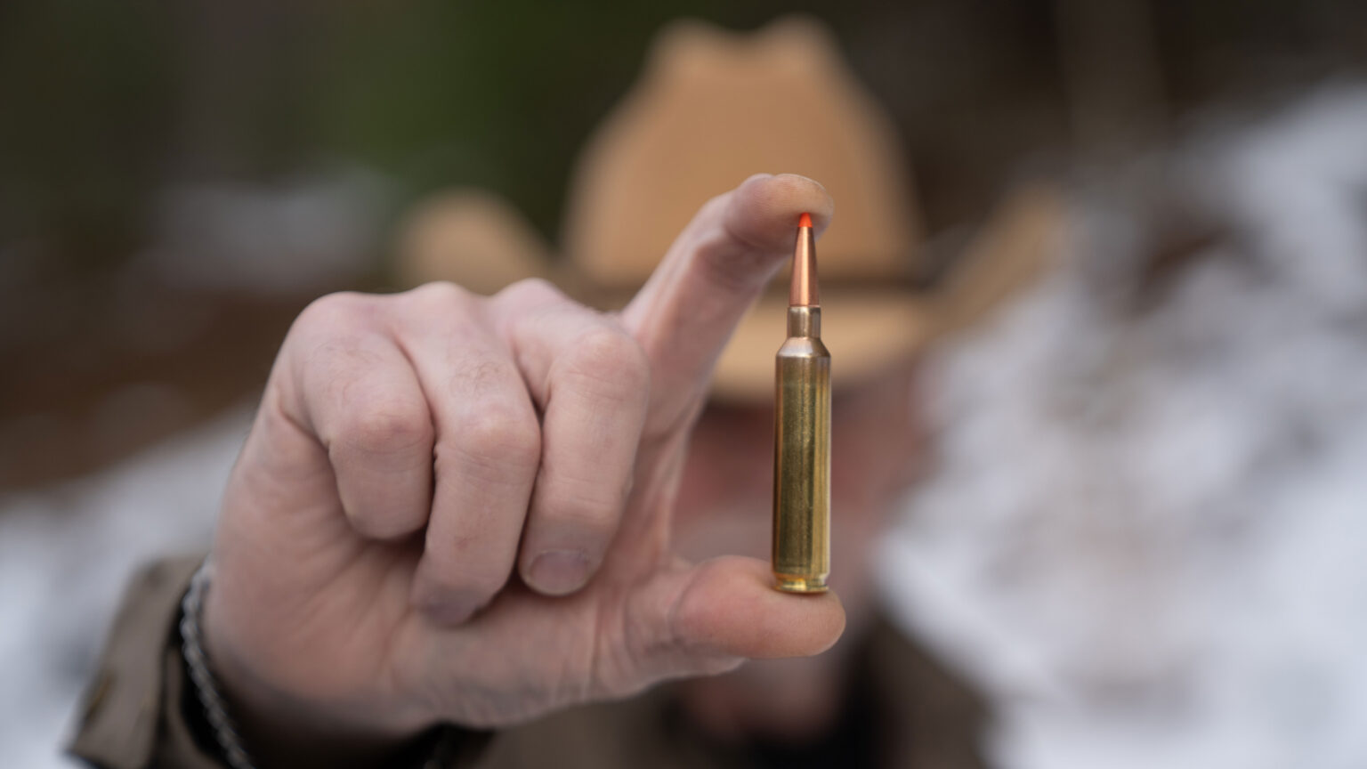A markman displays  Weatherby’s new 25 RPM cartridge.