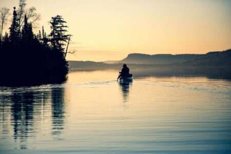 Anglers paddles a canoe in the Boundary Waters.