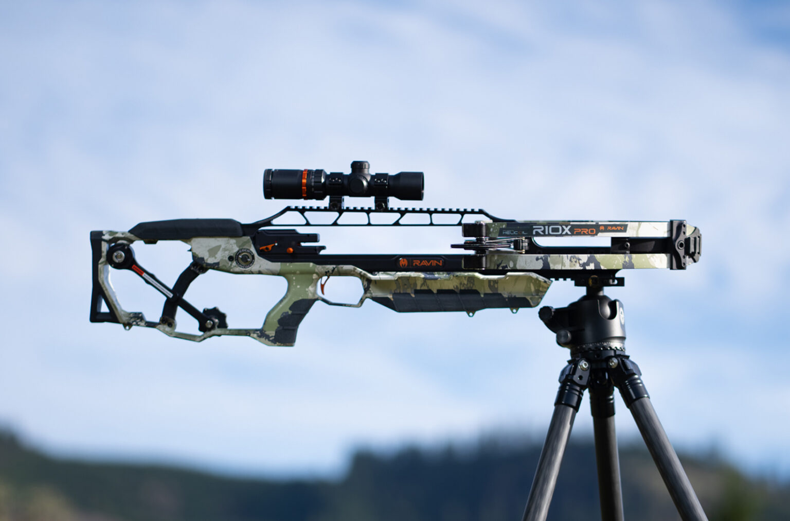 Ravin R10X Pro crossbow on a tripod in a field.