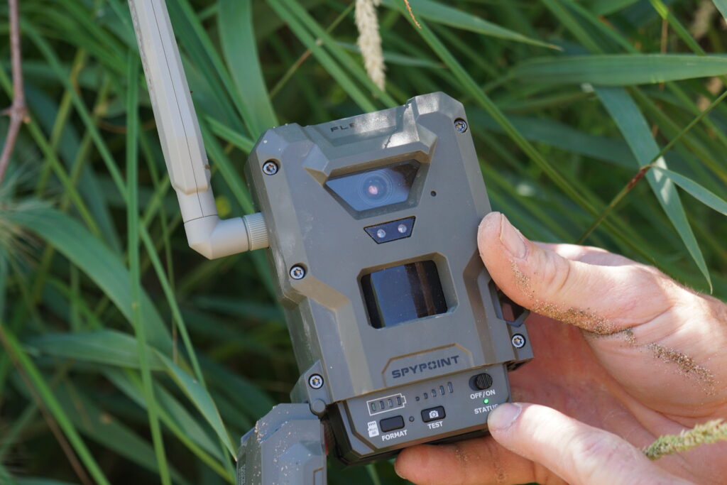 SpyPoint Flex M2 cellular trail camera in person's hand