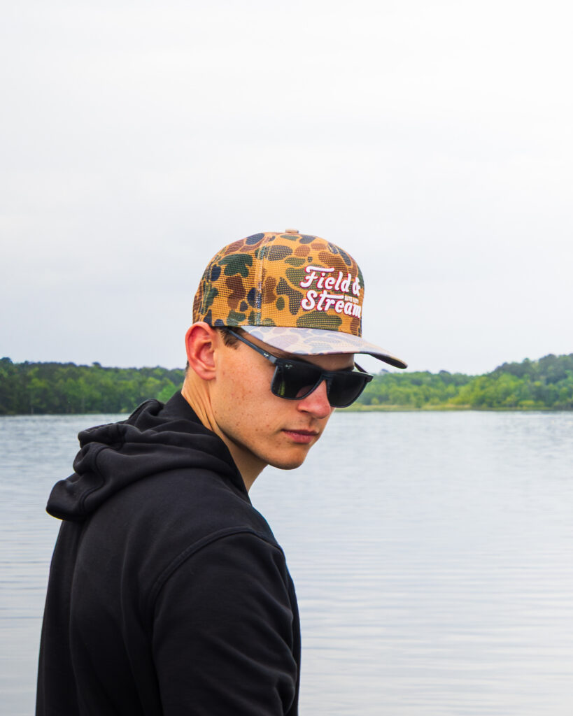 COrey Heim wearing a Field & STream hat